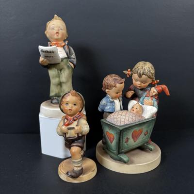 LOT 99: Set of 2 Hummels: Blessed Event & School Boy along with a Napco The Singer Figure