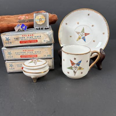 LOT 105: Eastern Star Bibles (3) in Original Boxes along with an Antique Bible Cover, Norcrest Eastern Star Teacup & More