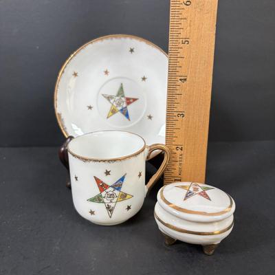 LOT 105: Eastern Star Bibles (3) in Original Boxes along with an Antique Bible Cover, Norcrest Eastern Star Teacup & More
