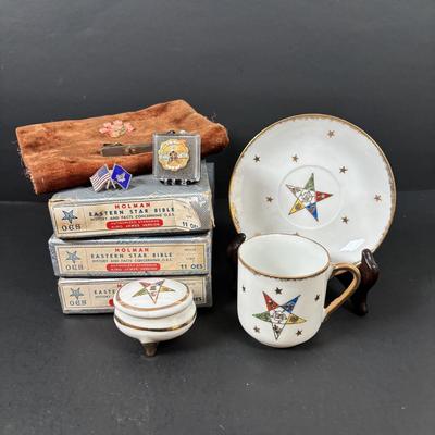 LOT 105: Eastern Star Bibles (3) in Original Boxes along with an Antique Bible Cover, Norcrest Eastern Star Teacup & More
