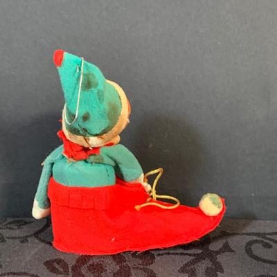 LOT 147: Assorted Collection of Vintage Holiday Decor Including Knee Huggers, Celluloid Santa in Sled, Paper Santa In Chimney, Dan Dee...
