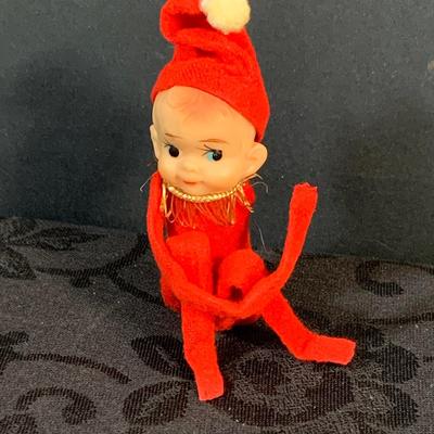 LOT 147: Assorted Collection of Vintage Holiday Decor Including Knee Huggers, Celluloid Santa in Sled, Paper Santa In Chimney, Dan Dee...