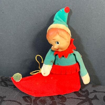 LOT 147: Assorted Collection of Vintage Holiday Decor Including Knee Huggers, Celluloid Santa in Sled, Paper Santa In Chimney, Dan Dee...