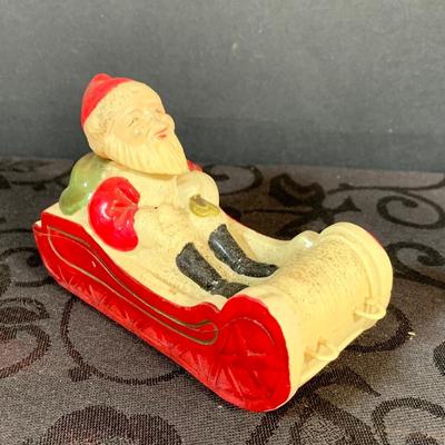 LOT 147: Assorted Collection of Vintage Holiday Decor Including Knee Huggers, Celluloid Santa in Sled, Paper Santa In Chimney, Dan Dee...