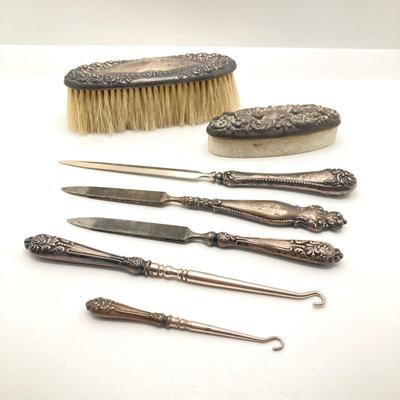 LOT 165: Vintage Sterling Handle Collection - Brush, Pumice Stone, Files, Hook Boot Lace Threaders and Letter Opener