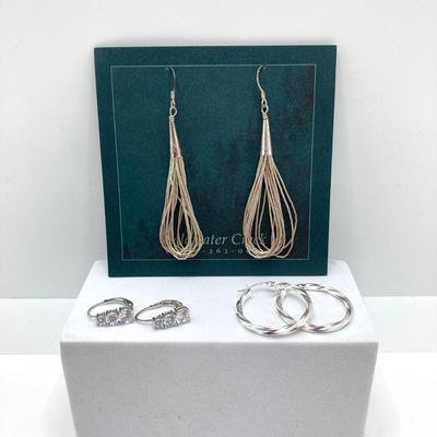 LOT 167: Collection of Sterling Pierced Earrings - Coldwater Creek Liquid Silver Dangle, Hoops and Loops Silver and Cubic Zirconia Styles