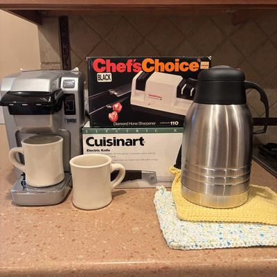 LOT 203: Kitchen Essentials: Keurig Model K10, Hot/Cold Carafe, Cuisinart Electric Knife, Chefs Choice Knife Sharpener & More
