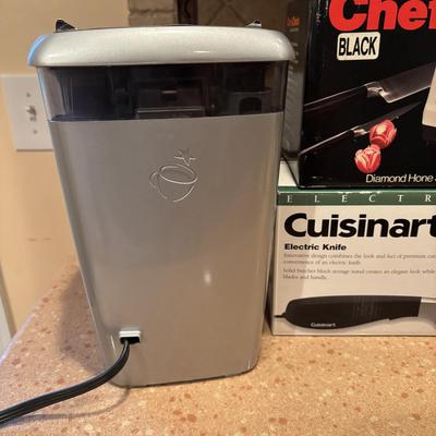 LOT 203: Kitchen Essentials: Keurig Model K10, Hot/Cold Carafe, Cuisinart Electric Knife, Chefs Choice Knife Sharpener & More
