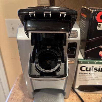 LOT 203: Kitchen Essentials: Keurig Model K10, Hot/Cold Carafe, Cuisinart Electric Knife, Chefs Choice Knife Sharpener & More
