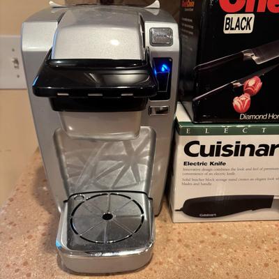 LOT 203: Kitchen Essentials: Keurig Model K10, Hot/Cold Carafe, Cuisinart Electric Knife, Chefs Choice Knife Sharpener & More