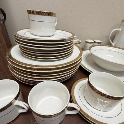 Sale Photo Thumbnail #196: In good condition with 1 piece chipped on underside.
8 dinner plates, 8 luncheon plates, 8 soup bows (1chipped on underside), 8 saucers, 8 cups, 1 coffee pot, 1 serving platter, 1 serving bowl, 1 sugar bowl (no creamer), 1 set of salt & pepper shakers.