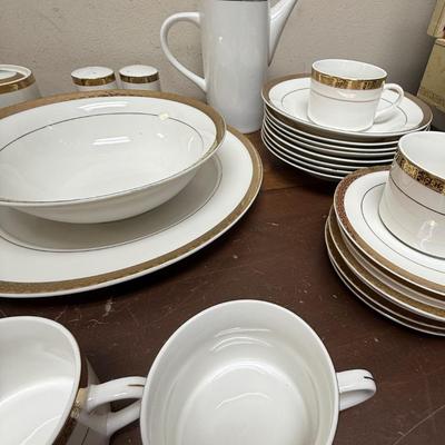 Sale Photo Thumbnail #194: In good condition with 1 piece chipped on underside.
8 dinner plates, 8 luncheon plates, 8 soup bows (1chipped on underside), 8 saucers, 8 cups, 1 coffee pot, 1 serving platter, 1 serving bowl, 1 sugar bowl (no creamer), 1 set of salt & pepper shakers.
