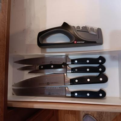 SET OF JA HENCKELS CUTLERY WITH SHARPENER