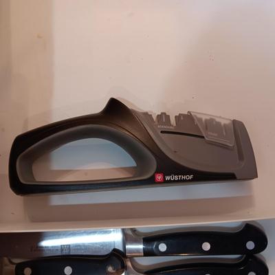 SET OF JA HENCKELS CUTLERY WITH SHARPENER