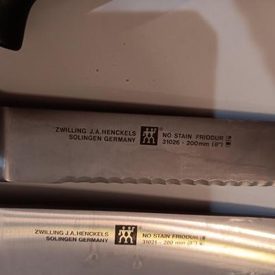 SET OF JA HENCKELS CUTLERY WITH SHARPENER