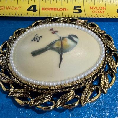 Vintage enamel and pearl bird brooch.