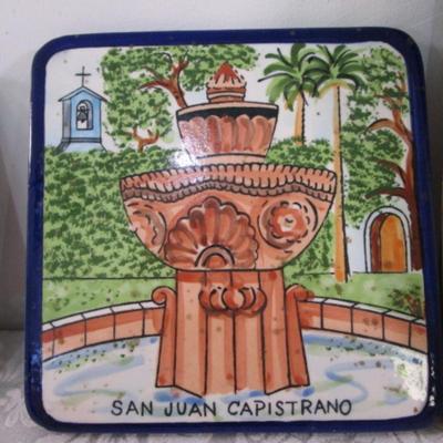 Sale Photo Thumbnail #268: Trivet is a scene in San Juan Capistrano, Rubbermaid twin turntable is  10-1/2" diameter 5-3/4" high white