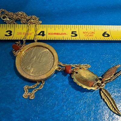 Coin necklace featuring a 2000 U.S. Sacagawea "Golden" Dollar coin as the central pendant.