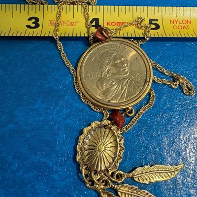Coin necklace featuring a 2000 U.S. Sacagawea "Golden" Dollar coin as the central pendant.