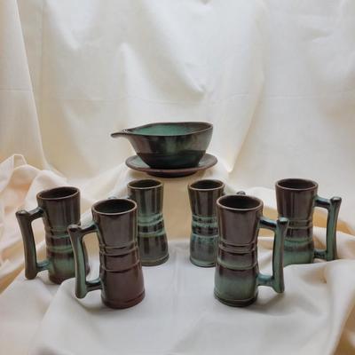 Sale Photo Thumbnail #677: Thera TEal color.  6 demitasse cups, 1 plate, 1 small bowl
Very good condition