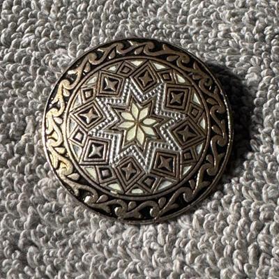 DAMASCENE Brooch, black, white, and gold design.