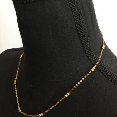 Very nice gold toned gold bead dainty necklace