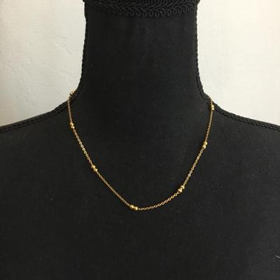 Very nice gold toned gold bead dainty necklace