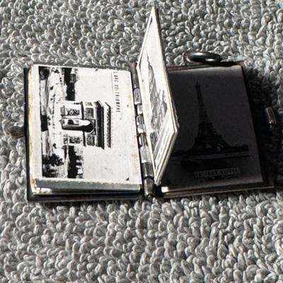 Vintage Paris souvenir book locket featuring the Eiffel Tower. 1930's