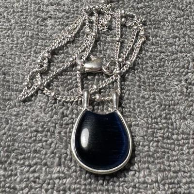 LIA SOPHIA necklace a striking navy blue oval-shaped pendant.