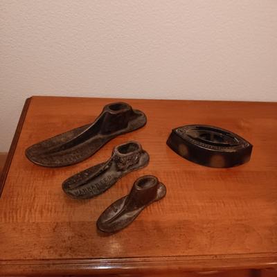 CAST IRON SHOE FORMS AND A CAST CLOTHES IRON