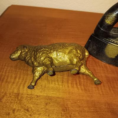 CAST IRON LAMB COIN BANK AND A CAST CLOTHES IRON