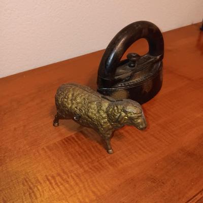 CAST IRON LAMB COIN BANK AND A CAST CLOTHES IRON