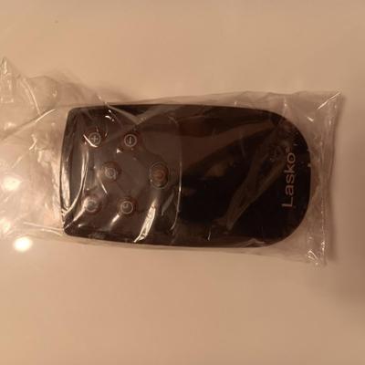 LASKO HEATER WITH REMOTE, CARDINAL CERAMIC WASTE CAN AND KLEENEX HOLDER PLUS A SET OF TOWELS