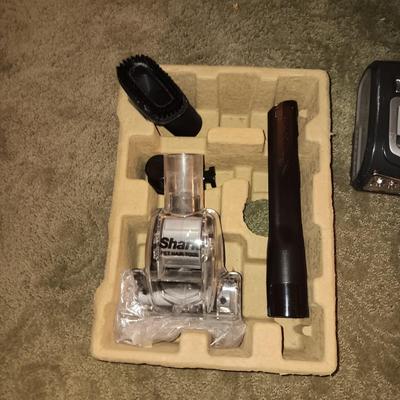 SHARK NAVIGATOR BAGLESS VACUUM AND A FOLDING STEP STOOL