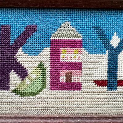 Sale Photo Thumbnail #66: Needle point is framed and measures 18.25" x 6.25" with table lamp with lamp shade that does not sit on straight measuring 14"H