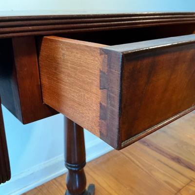 Sale Photo Thumbnail #106: Mahogany with burled walnut drawer with brass clawed feet.
Measure 17.5"W x 15.5"D x 27.5"H, leafs up is 29"L