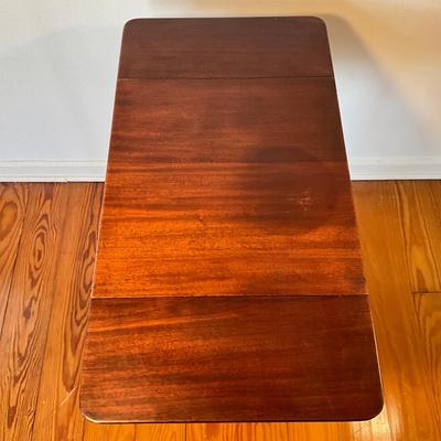 Sale Photo Thumbnail #104: Mahogany with burled walnut drawer with brass clawed feet.
Measure 17.5"W x 15.5"D x 27.5"H, leafs up is 29"L