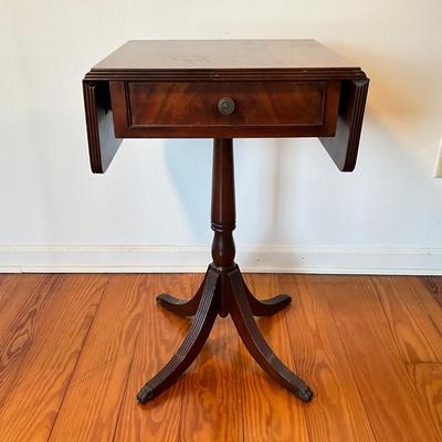 Sale Photo Thumbnail #103: Mahogany with burled walnut drawer with brass clawed feet.
Measure 17.5"W x 15.5"D x 27.5"H, leafs up is 29"L
