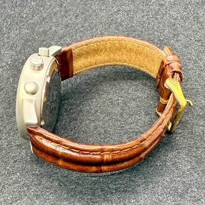 Sale Photo Thumbnail #284: With leather band. White face with 3 inset dials, luminous hands and numbers and a red sweep second hand. Date window at the 4 position. Not running, most likely needs a new battery.