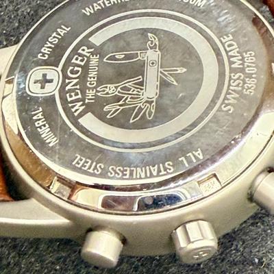 Sale Photo Thumbnail #283: With leather band. White face with 3 inset dials, luminous hands and numbers and a red sweep second hand. Date window at the 4 position. Not running, most likely needs a new battery.