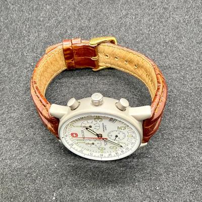Sale Photo Thumbnail #282: With leather band. White face with 3 inset dials, luminous hands and numbers and a red sweep second hand. Date window at the 4 position. Not running, most likely needs a new battery.
