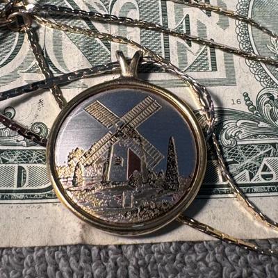 REED & BARTON Damascene pendant featuring a detailed windmill scene,