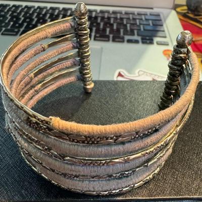 Wide cuff bracelet, showcasing a blend of materials