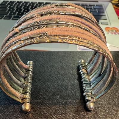 Wide cuff bracelet, showcasing a blend of materials