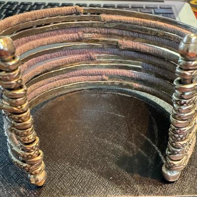 Wide cuff bracelet, showcasing a blend of materials