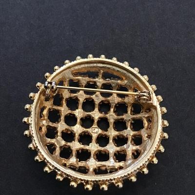 Sale Photo Thumbnail #100: Beautiful vintage, gold tone, multicolored rhinestone dome brooch. Please see attached photos.