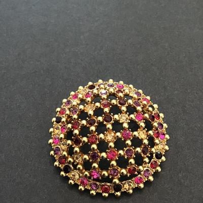 Sale Photo Thumbnail #99: Beautiful vintage, gold tone, multicolored rhinestone dome brooch. Please see attached photos.