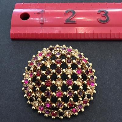 Sale Photo Thumbnail #101: Beautiful vintage, gold tone, multicolored rhinestone dome brooch. Please see attached photos.