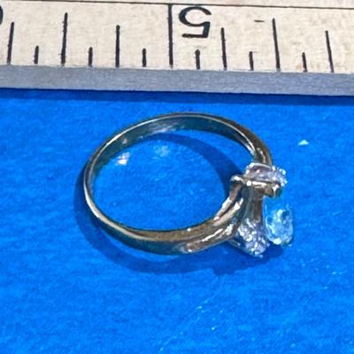 Ring featuring a prominent aquamarine gemstone.