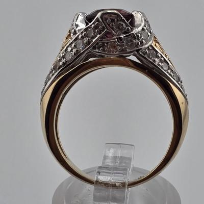 Lot 25: 14k Gold Ring with Garnet Center Stone and Diamond Accent Stones / Size 6.5 / 8g